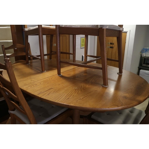 435 - An Ercol light oak 'D' end extending dining table, 84