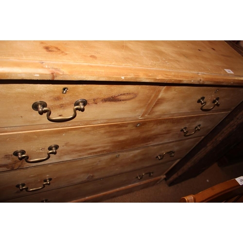 502 - A 19th century stripped pine chest of two short and three long drawers with brass loop handles, 44