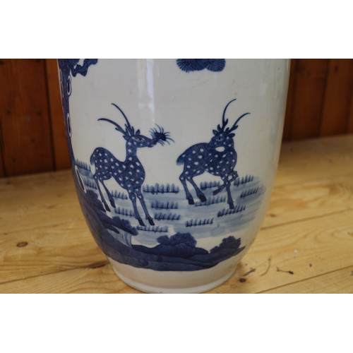 110 - A pair of Chinese porcelain blue and white baluster vases, decorated fallow deer, 17 3/4