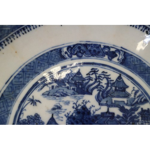 103 - A 19th century blue and white porcelain dish with lobed edge and central willow pattern panel, 10