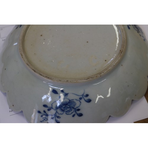 103 - A 19th century blue and white porcelain dish with lobed edge and central willow pattern panel, 10