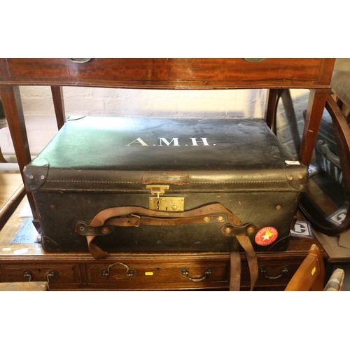 538 - A leather trunk, fitted brass lock, and a metal bound wooden trunk, stencilled Hunnings, 37