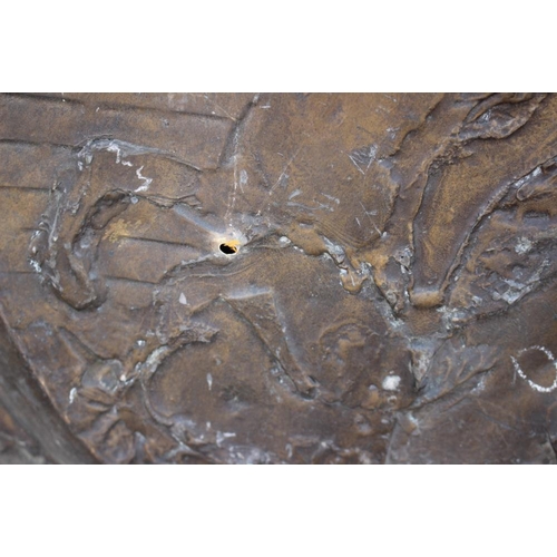 200 - A circular embossed copper plaque, traces of gilding, centre with Battle of Anghiari after Leonardo,... 