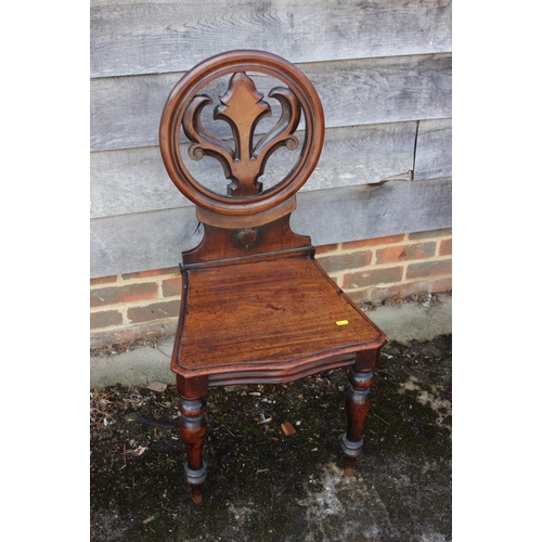 559 - A 19th century mahogany hall chair with Gothic pierced back, on turned supports, and a 19th century ... 