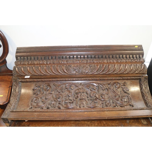 562 - A 19th century oak over-door moulding, carved gadroons, scrolls and central mask, 43