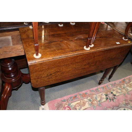 657 - A 19th century oak Pembroke table, on turned supports, 38