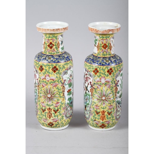 132 - A pair of Chinese cylinder vases, decorated polychrome panels with animals and flowers, 10