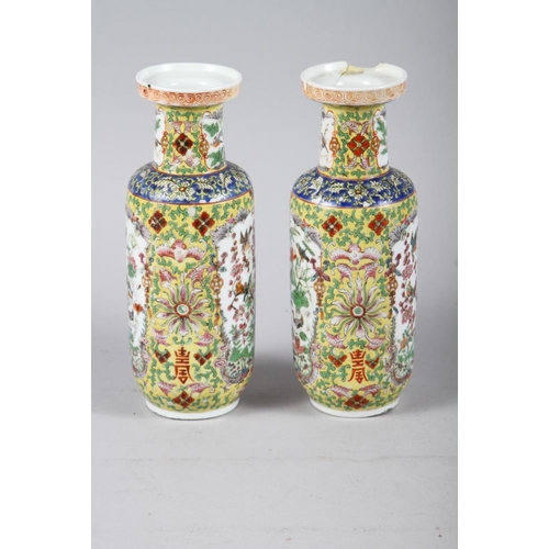 132 - A pair of Chinese cylinder vases, decorated polychrome panels with animals and flowers, 10