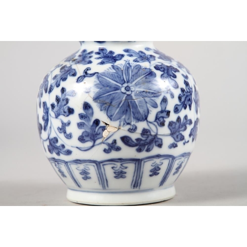 136 - A pair of Chinese blue and white triple gourd vases with floral decoration, 9 3/4