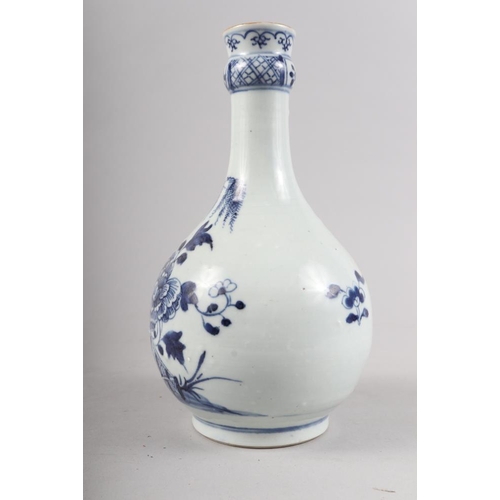 138 - A Chinese porcelain blue and white fence and peony decorated bottle vase, 9 1/2