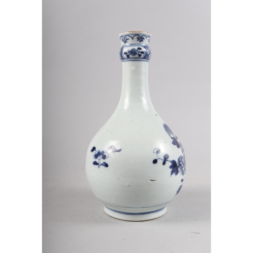 138 - A Chinese porcelain blue and white fence and peony decorated bottle vase, 9 1/2