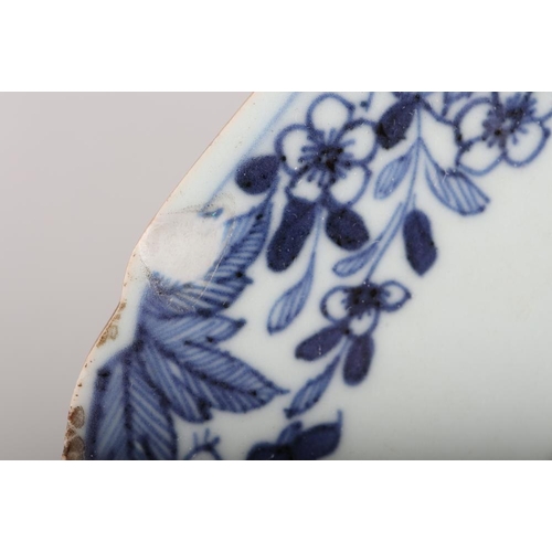 143 - A pair of Chinese blue and white and enamel decorated octagonal chargers with figures in a small boa... 