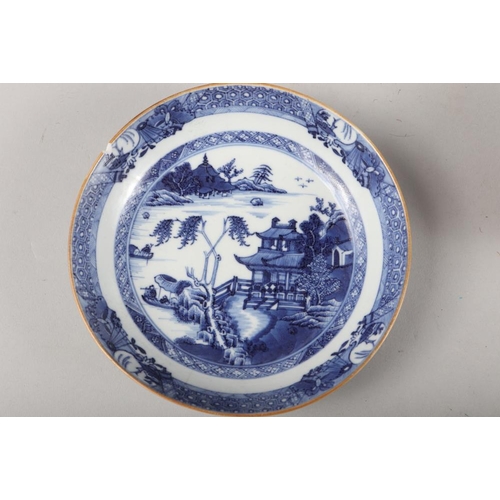 147 - A Chinese blue and white saucer dish with pheasant and tree design, 11