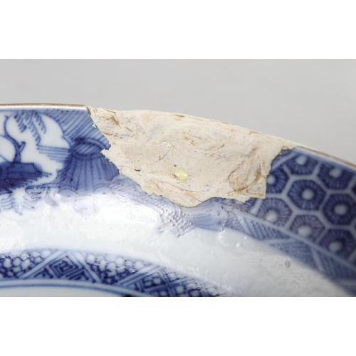 147 - A Chinese blue and white saucer dish with pheasant and tree design, 11