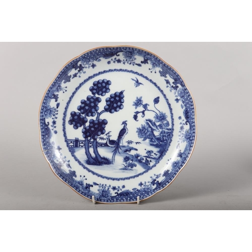 147 - A Chinese blue and white saucer dish with pheasant and tree design, 11