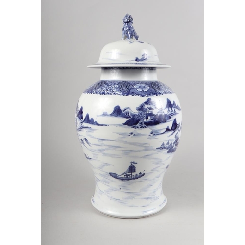 149 - A Chinese porcelain blue and white landscape decorated jar and cover with Dog of Fo finial, 17 1/2