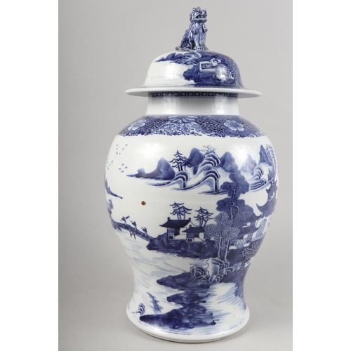 149 - A Chinese porcelain blue and white landscape decorated jar and cover with Dog of Fo finial, 17 1/2