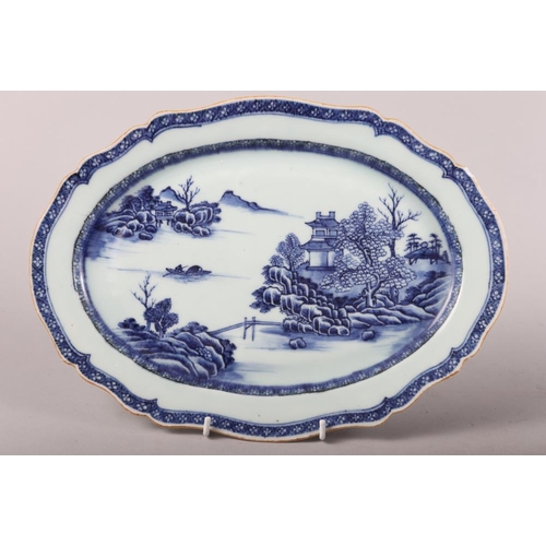 150 - A pair of Chinese porcelain blue and white landscape decorated shaped oval dishes, largest 13 1/2