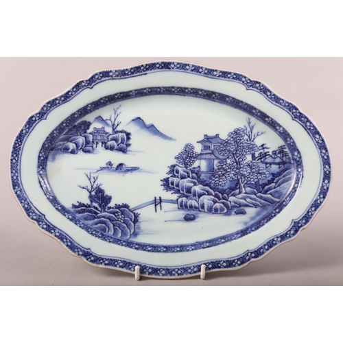 150 - A pair of Chinese porcelain blue and white landscape decorated shaped oval dishes, largest 13 1/2