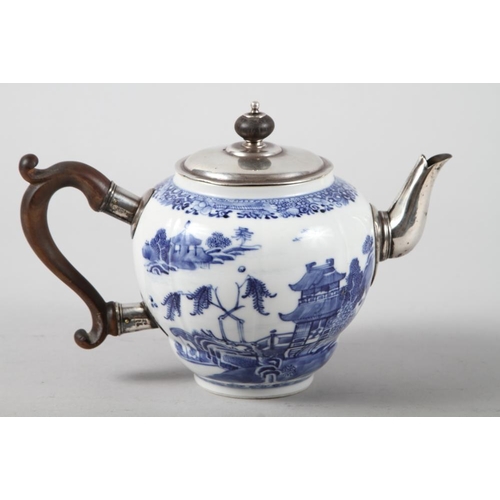 155 - A 19th century Chinese blue and white teapot with white metal mounts, decorated landscape with build... 