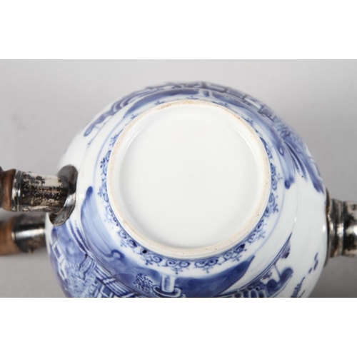 155 - A 19th century Chinese blue and white teapot with white metal mounts, decorated landscape with build... 