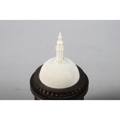 157 - An ebonised fluted box with carved ivory domed and spire top 5 1/2