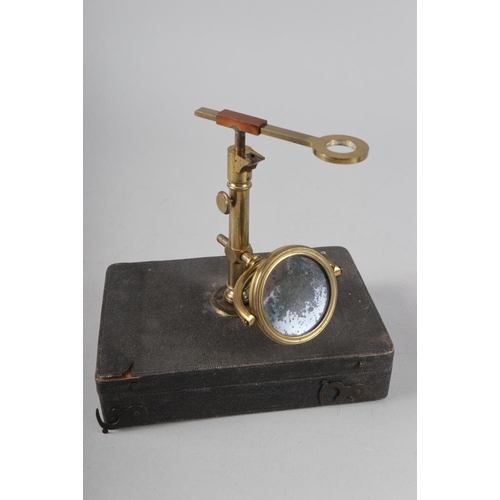 174 - A late 18th century brass travelling microscope, in fitted case (incomplete), and a student's portab... 