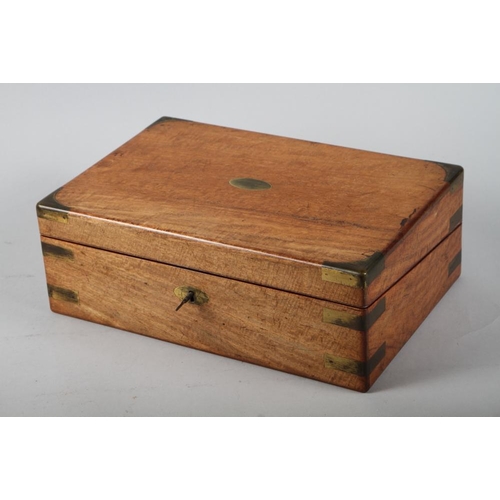 204 - A 19th century figured mahogany and brass inlaid writing box with part fitted interior, 14