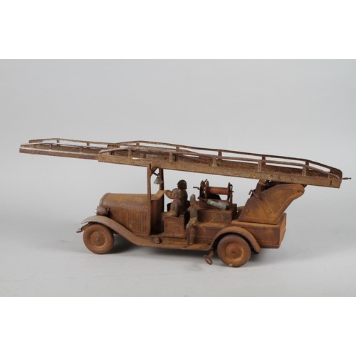 211 - A German tin-plate model of a fire engine, 28 3/4