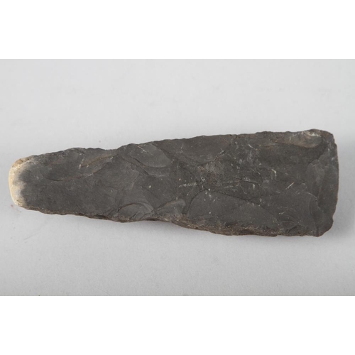 279 - A Maori rough carved hardstone axehead, 5 1/2