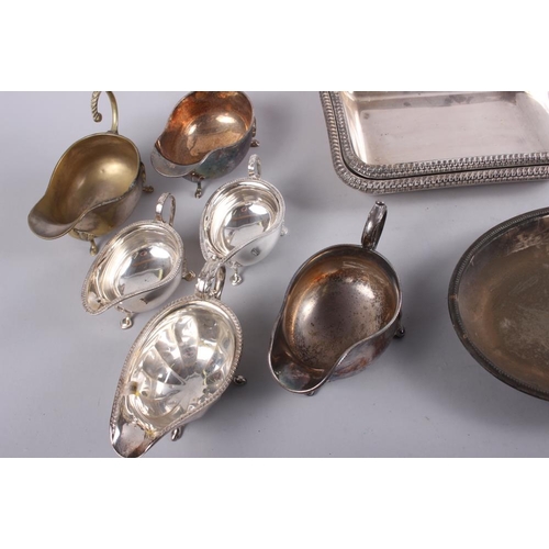 318 - A quantity of silver plated entree dishes and six plated sauce boats