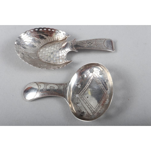 332 - A Georgian silver caddy spoon with pierced and brightcut decoration and a similar Georgian silver ca... 