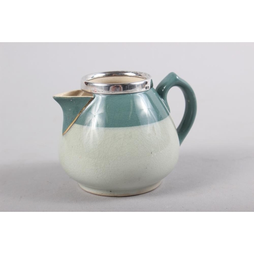 340 - A late 19th century  Macintyre silver rimmed two-tone green glazed cream jug, 2 3/4