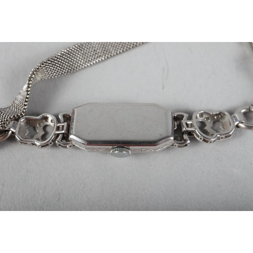 396 - A 1930s platinum and diamond set cocktail watch with 9ct white gold chain-link strap