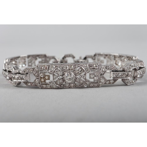 430 - An Art Deco white metal and diamond bracelet comprising three rectangular panels with chain links, 3... 