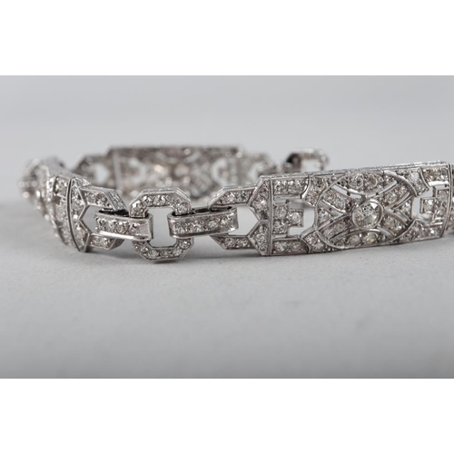 430 - An Art Deco white metal and diamond bracelet comprising three rectangular panels with chain links, 3... 