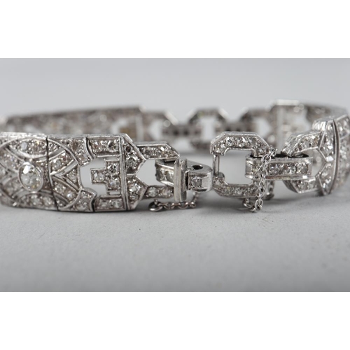 430 - An Art Deco white metal and diamond bracelet comprising three rectangular panels with chain links, 3... 