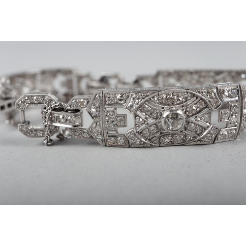 430 - An Art Deco white metal and diamond bracelet comprising three rectangular panels with chain links, 3... 