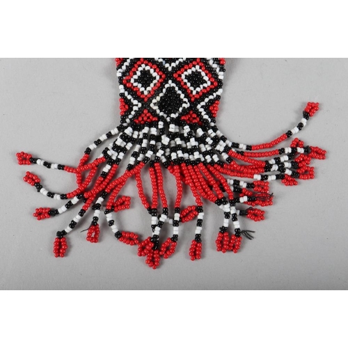 439 - A beadwork necklace with geometric decoration