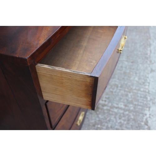 539 - A 19th century mahogany bowfront chest of two short and three long drawers with embossed brass handl... 