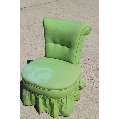 541 - A late 19th century low seat nursing chair, button upholstered in a green linen