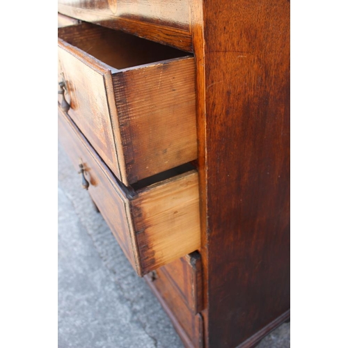 544 - A late 18th century provincial oak and mahogany banded chest of two short and three long graduated d... 