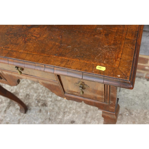 552 - A late 17th century/early 18th century oak lowboy, fitted three drawers over shaped kneehole, on cab... 