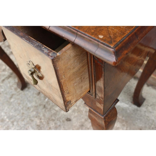 552 - A late 17th century/early 18th century oak lowboy, fitted three drawers over shaped kneehole, on cab... 