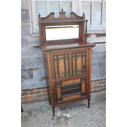 619 - An Edwardian rosewood and inlaid music cabinet with mirror panel back over panelled door, 30