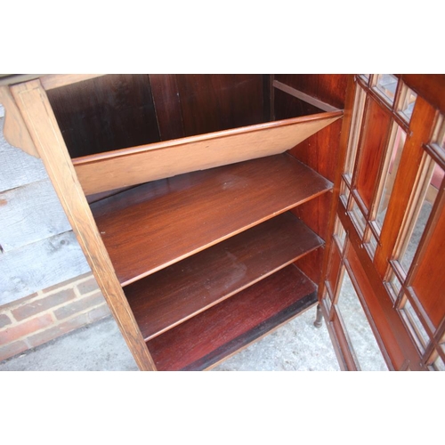 619 - An Edwardian rosewood and inlaid music cabinet with mirror panel back over panelled door, 30