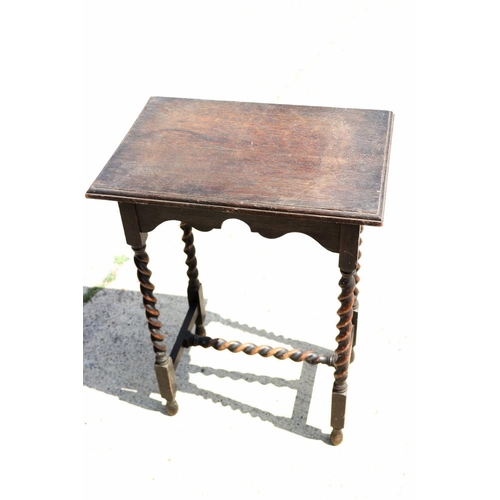 622 - An oak occasional table, on barley twist turned and stretchered supports