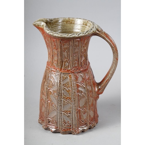 63 - Richard Dean: a stoneware jug with carved decoration, 10