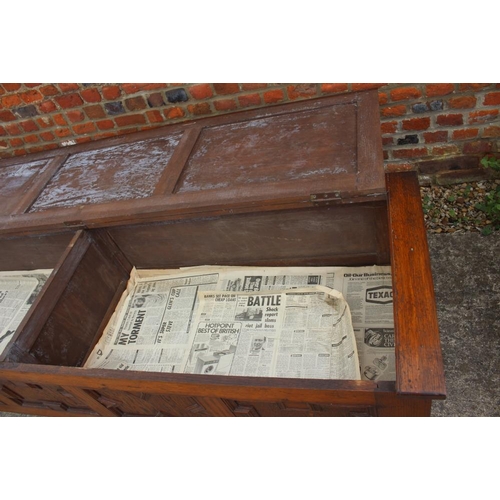 642 - An oak coffer with 17th century design panel front, on Sheppard castors, 83