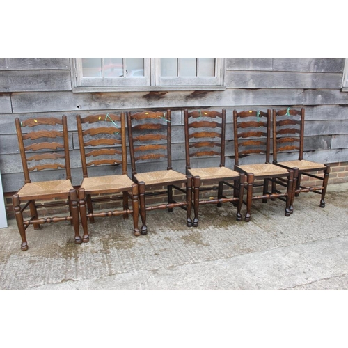 667 - A closely matched set of eight oak rush seat ladderback dining chairs, on turned and stretchered sup... 